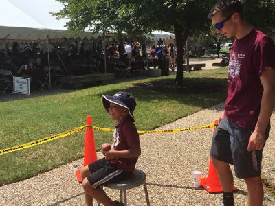 A child experiencing angular momentum.