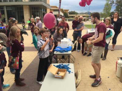 A student breaking racquetballs with liquid nitrogen.